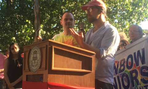 Local residents Ed Bailey (left) and Tony Barini speak about a friend, KJ "Kim" Morris, who was murdered in the Pulse mass shooting in Orlando, Fla. June 12, 2016 (photo by Jason Velázquez)