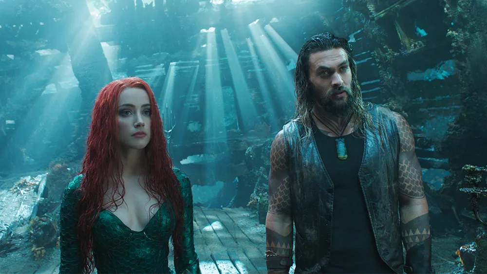 Actress Amber Heard and Actor Jason Momoa in a scene from the 2018 film, "Aquaman."