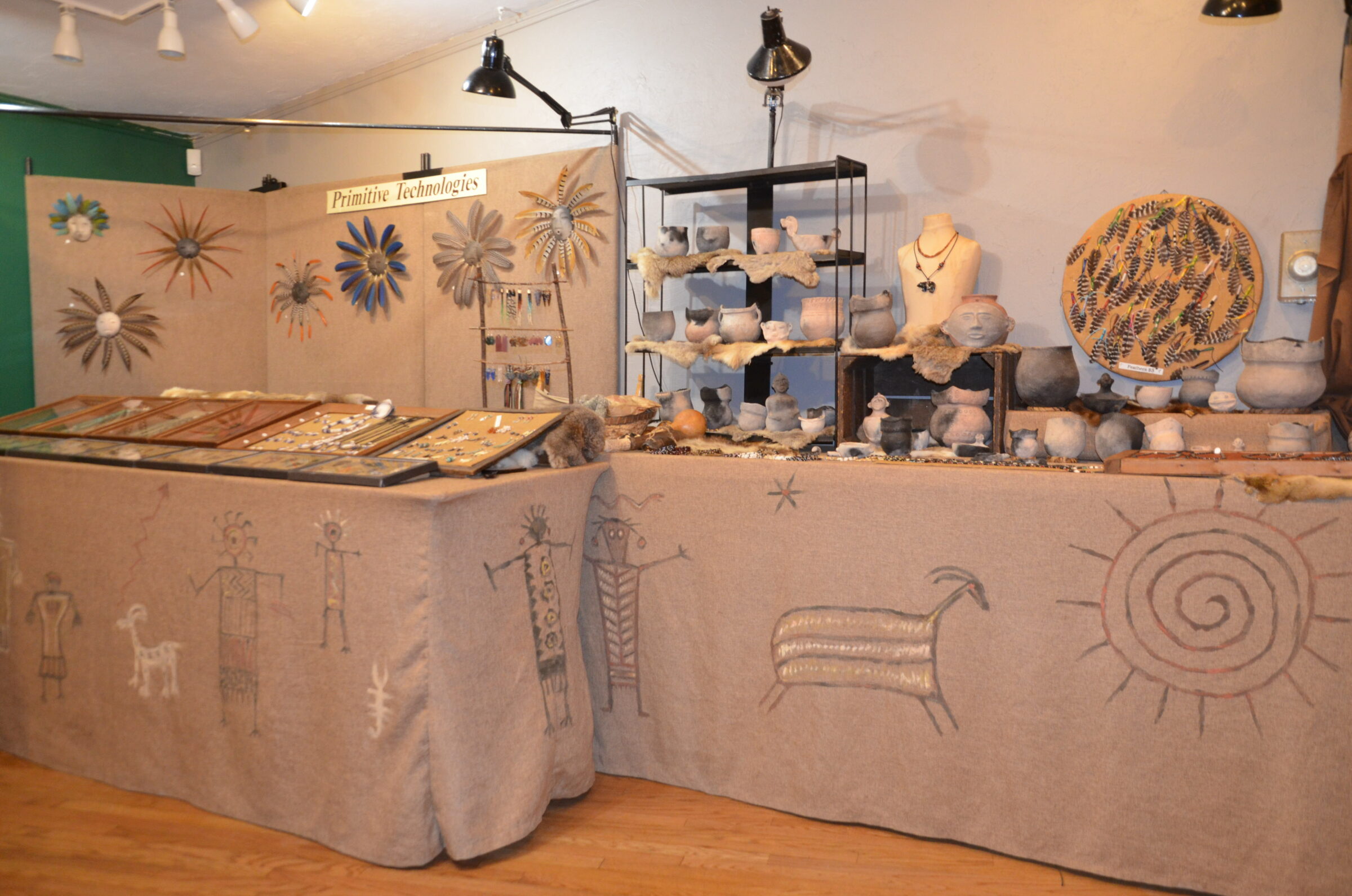 Long shot of displays on tables in a Native American Museum and Gift shop