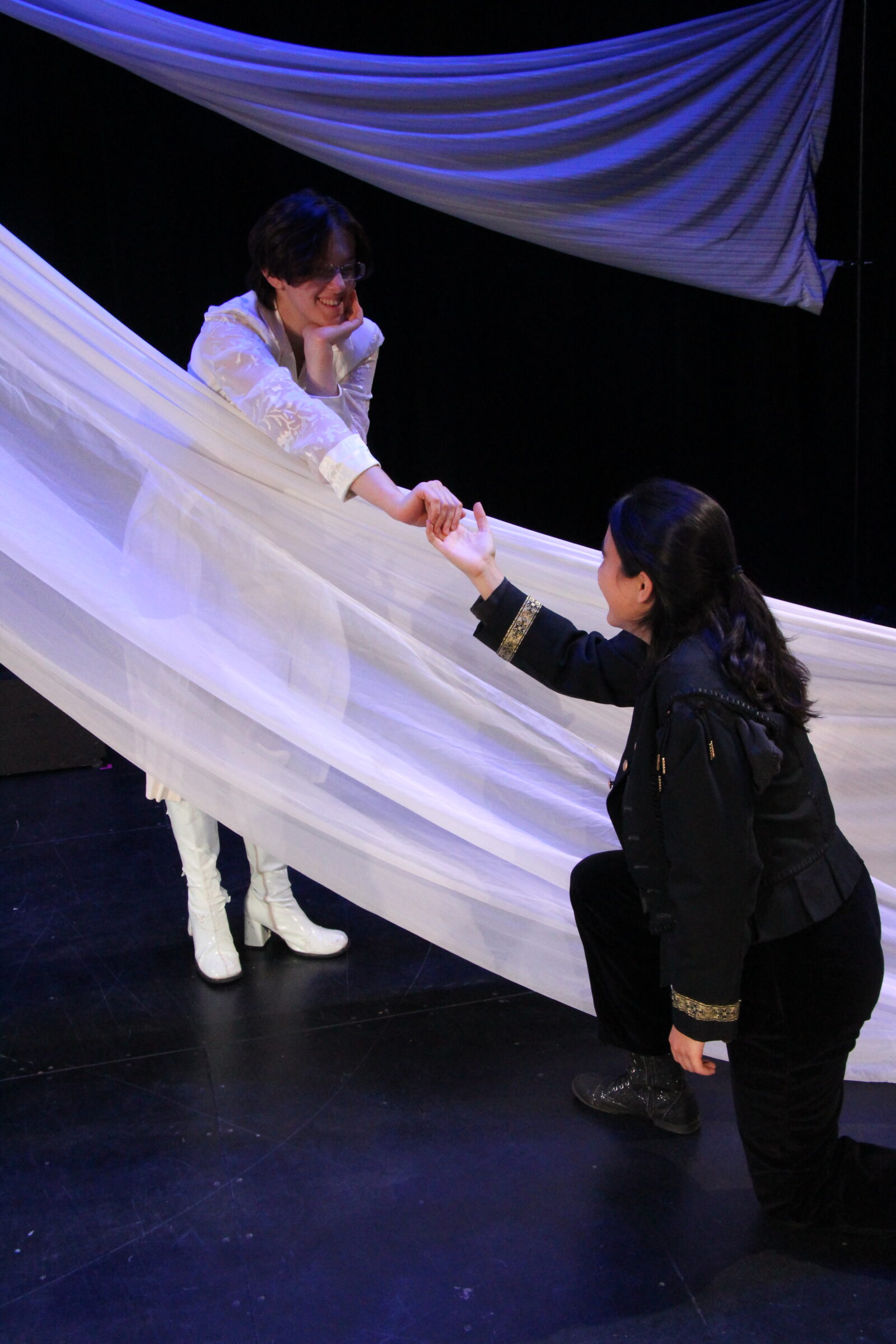 Two student actors enacting a scene from Romeo and Juliet.
