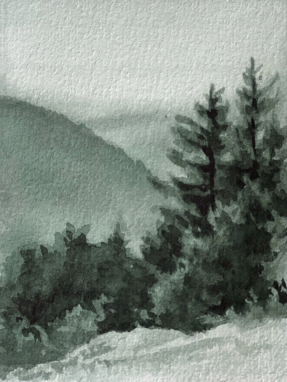 A watercolor painting by Jill Gustavis titled 'Celadon Watercolor Landscape.' The artwork depicts a serene, mountainous landscape with trees in the foreground and rolling hills fading into the background. The entire scene is rendered in soft, muted green tones, creating a tranquil and misty atmosphere.